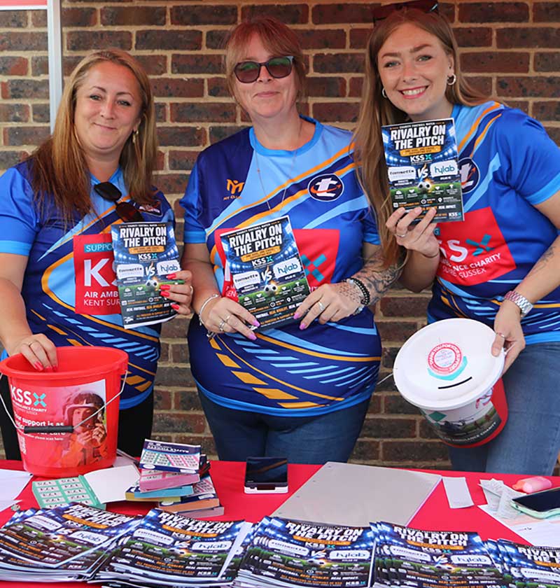 Tomsetts Fundraising team with buckets at football match